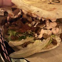 SHAWARMA Pita (Plantbased Shawarma, Pink Garlic Sauce, Harissa Tomato, Roasted Eggplant Spread) 9,50€  at Zeta in The Hague