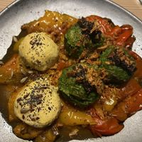 Spinach and polenta dumpling with peppers  at Sankt Annas - Augustenstraße  in Munich