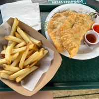 Two veggie empanadas with a side of fries at El Yunique Rainforest Cafe in Rio Grande