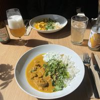 Jackfruit korma with rice and tzatziki and chickpea & cauliflower curry with rice.  at Cultivate Food in Oslo