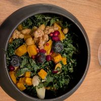 Kale salad with fruits, nuts, sweet potatoes and other veggies at Cultivate Food in Oslo