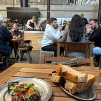 Berenjena platito (GET IT!!) with chibatta bread with a view of the kitchen at Chuí in Buenos Aires