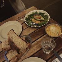 Focaccia, charred avovado with kimchi and peanut soup — HIGH recommendation for all of these! at Chuí in Buenos Aires