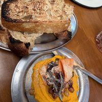 Hummus de zanahoria y pan de masa madree  at Chuí in Buenos Aires