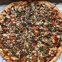 Garden Grove vegan pizza: Fresh sliced tomato, artichoke, spinach, red onion, mushroom, basil, vegan mozzarella, red sauce & herbs with a fig balsamic drizzle on top.   at Headies Pizza & Pour in Trinidad