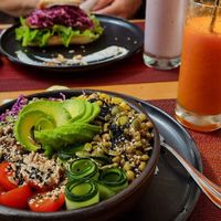 Buddha bowl with quinoa and mung beans. Carrot, generally and orange smoothie at Hablemos Coco Cafe in Puerto Natales