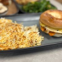 “Egg” Breakfast sandwich perfectly paired with hash.  at Vegas Vegan Eatery in Las Vegas