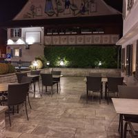 Outdoor seating (at night) at Gasthof Hirschen in Regensdorf