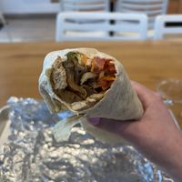 Grilled C Wrap- Grilled vegan chick'n, grilled onions, cabbage, carrot, lettuce, tomato, with 1000 Island dressing. Wrapped in a flour tortilla.  at Envegan in East Point