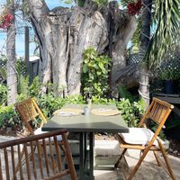 Outdoor seating at Driftwood cafe in Great Exuma