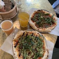 Pizza with squash and pesto and with pepperoni + cider and kombucha  at KOM in Moscow