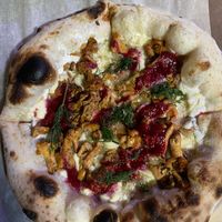 Лисички с брусничным соусом и вег сыром  at KOM in Moscow