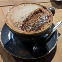 Oat milk cappuccino  at Nine Leaves in Wirral