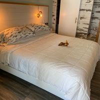 Comfy bed with little stuffed deer to greet us. at Deer Run Bed and Breakfast in Big Pine Key