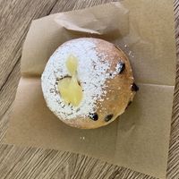 Bombolone con gocce di cioccolato ripieno di crema pasticcera  at Vegustibus in Rome