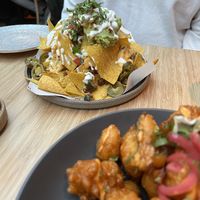 Nachos 10/10, and cauliflower wings 6/10  at Madre in Amsterdam