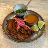 ‍‍BIRRIA QUESATACOS 
‍Corn tortillas filled with slow braised re-defined (3D printed) ‘pork’ in a smoky and savoury broth, served with dipping broth  at Madre in Amsterdam