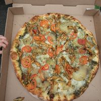 Pesto chicken pizza at Pi Vegan Pizzeria in Seattle