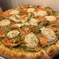 Pesto Pi: Pesto base, fresh tomatoes, potatoes, and seasoned chick'n, modified to use cashew ricotta instead of the mozzarella. Delicious!  at Pi Vegan Pizzeria in Seattle