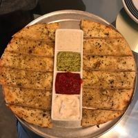 Cheesey bread and sauce sampler... So good!  at Pi Vegan Pizzeria in Seattle