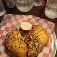 Meat Lovers Calzone at Pi Vegan Pizzeria in Seattle