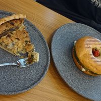 Quiche with mushrooms and bagel with vegan goat cheese, pesto and baked tomatoes. at Share Sweet & Wine Bar in Prague
