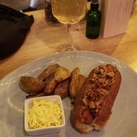 Hot dog with potatoes at Share Sweet & Wine Bar in Prague