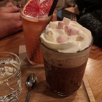 Hit chocolate and mini marshmallows. Grapefruit lemonade in the background at Share Sweet & Wine Bar in Prague