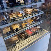 Display case with cakes, etc.  at Share Sweet & Wine Bar in Prague