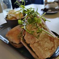 Toasted ciabatta with Cajun sweet potato, vegan feta, peppers. at Ochiltree's Cafe in Melrose