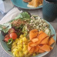 Poke bowl and burger in distance! at Brunch Club in Funchal
