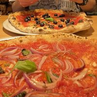 Two modified marinara pizzas - one with red onion and one with olives   at Pizzeria Lume in Funchal