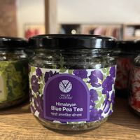 Shop sells many nice things, both edible and not (like candles and body care)   at Greenr Cafe in New Delhi