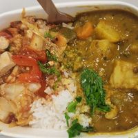 Tomato tofu, rice, potato lentil curry. at HeartFood in Hobart