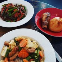 Yellow curry, sesame bean, soy drumstick, and BBQ bun. at HeartFood in Hobart