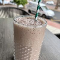 Caribbean kiss smoothie with oat milk   at Sisters Coffee Shop And Kitchen in Tenerife