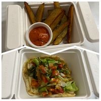 Fresh-cut fries with za’atar and house-made harissa mayo, plus vegan crab cakes on house-made naan. at Deck's Plate - Maybe closed in Sarasota