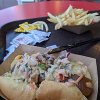 Plant-based Loaded Slaw Dog
Plant-based "Sausage" topped with Pickled Slaw, Barbecue Vegan Aïoli, and Roasted Corn Relish served with French Fries at Walt Disney World - Casey's Corner in Lake Buena Vista