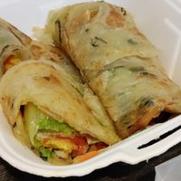 Scallion bread filled with lettuce, tomato, mayo, tofu skin? and more at Vegan Resort 啼岸 in Taipei