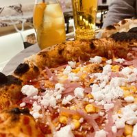 Vegan Pizza with onions, corn and Vegan Violife Chees 10/10  at Wolke in Vienna