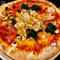 Pizza with vegan cheese and vegetables at Gioia in Dusseldorf