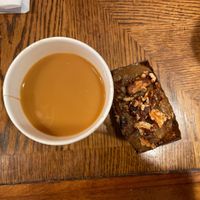 A coffee with oat milk and a mini cake. *Not seen was a vegan muffuletta and Kobocha squash hummus meal that I devoured!  at Malvern Buttery in Malvern