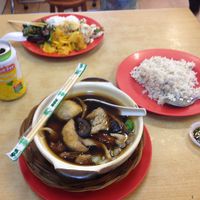 Rice and buffet dishes in background, buk kut teh with brown rice in foreground  at Sweet Veggie in Kuala Lumpur