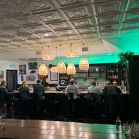 A long table for families and a swanky bar at 14 Parishes on Oak in New Orleans