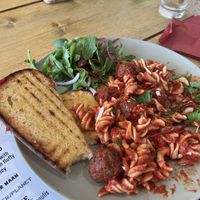 Vegan meatball pasta with garlic bread  at VK Plant Based Diner in Waterlooville