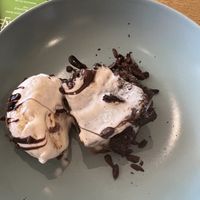Chocolate caramel warm brownie stack with ice cream  at VK Plant Based Diner in Waterlooville