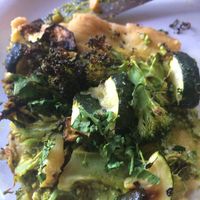 pizza slice loaded with good stuff! at Flying Apron Bakery - Fremont Ave in Seattle