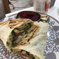 The veggiewrap with fermented beetroot on the side   at Vegan Spectrum مطبخ الطيف النباتي in Amman