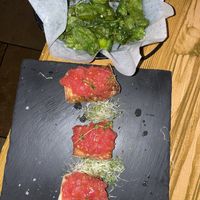 Fried baby green peppers and Toasted homemade artisanal bread with tomatoes and garlic at Eatapas in Fort Lauderdale