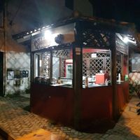 Snack stand with outdoor seating at Acarajé Experto in Itacare